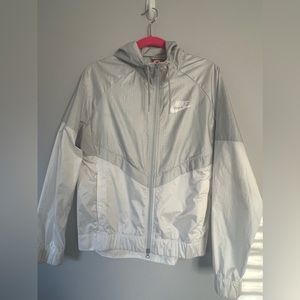 - NIKE women’s zip up wind breaker size M